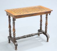 A VICTORIAN INLAID WALNUT SIDE TABLE, the rectangular parquetry top raised on turned legs. 69.5cm