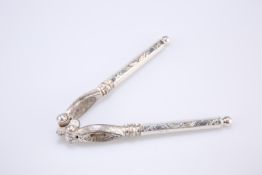 A PAIR OF VICTORIAN NUT CRACKERS, London 1886, the hinged metal head with hexagonal silver