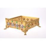 A GOTHIC REVIVAL 'JEWELLED' BRASS MISSAL STAND, CIRCA 1870, pierced square form, decorated to two