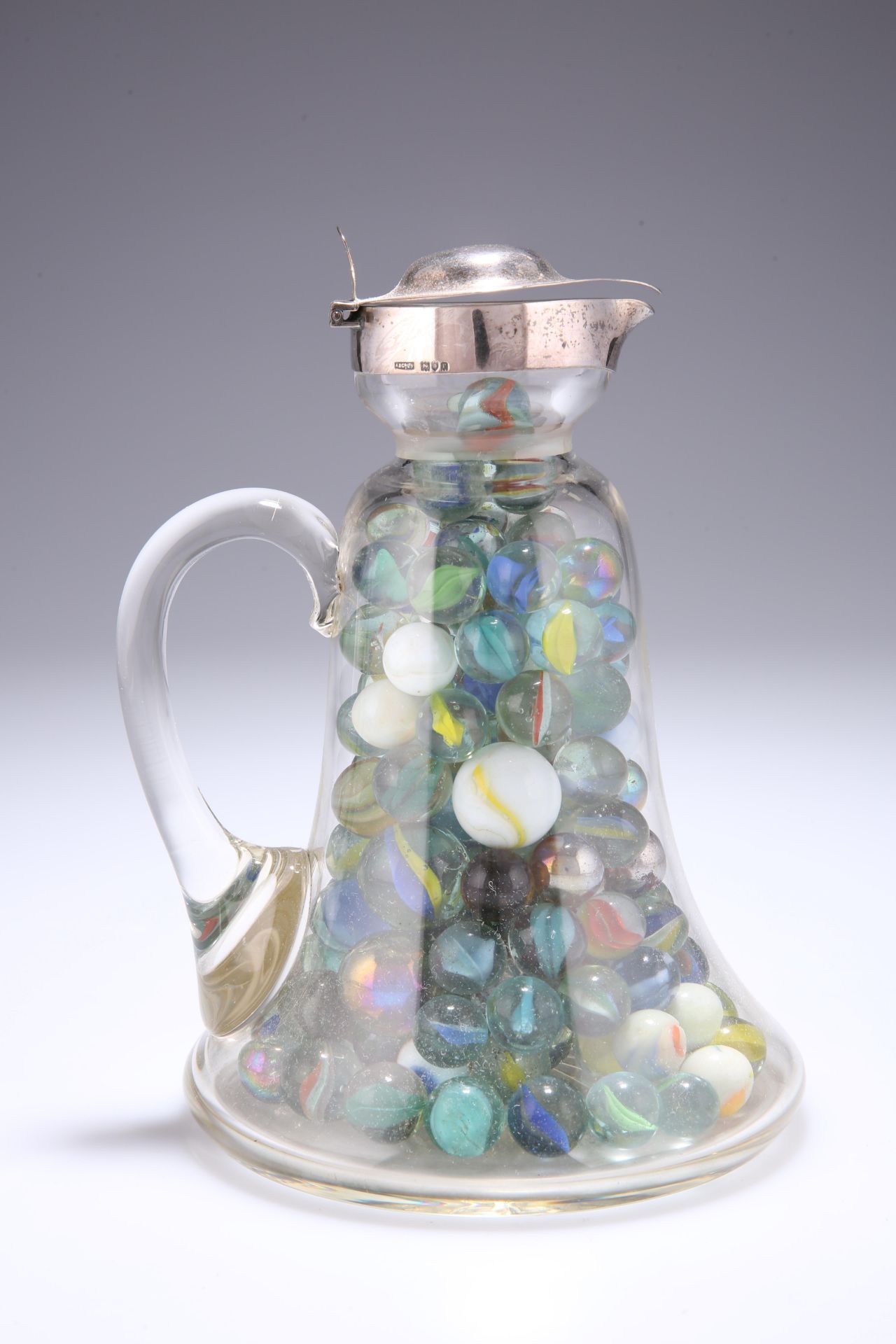 A GEORGE V SILVER-TOPPED CLARET JUG, Asprey & Co. Ltd., London 1912, the bell-shaped glass body with