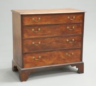 A GEORGE III MAHOGANY CHEST OF DRAWERS, the moulded rectangular top above four long graduated