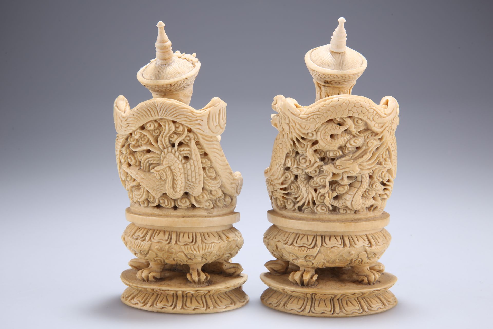 A PAIR OF CHINESE IVORY FIGURES, 19TH CENTURY, carved as a seated emperor and empress, each bears - Bild 2 aus 3