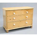 A VICTORIAN PINE CHEST OF DRAWERS, the moulded rectangular top with rounded corners above two