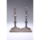 A PAIR OF OLD SHEFFIELD PLATE CANDLESTICKS, tapered knopped stems, with wrythen fluted decoration,