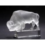 RENÉ LALIQUE (FRENCH, 1860-1945) A 'BISON' PAPERWEIGHT, DESIGNED IN 1931, clear glass, frosted and