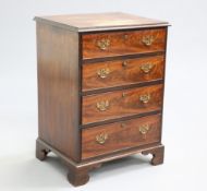 A GEORGE III STYLE MAHOGANY CHEST OF DRAWERS, of small proportions, the moulded rectangular top