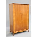 AN ALFRED COX FIVE PIECE WALNUT BEDROOM SUITE comprising his and hers wardrobes, dressing table,