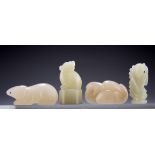 FOUR CHINESE JADE CARVINGS, comprising a crouching rat, 4cm long; a female figure, 3cm long; a