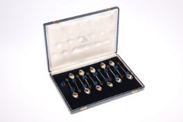 A CASED SET OF ELEVEN SILVER METAL COFFEE SPOONS, with brown plastic coffee bean tops, stamped '