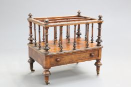 A VICTORIAN INLAID BURR WALNUT CANTERBURY, with base drawer and short baluster legs with castors.