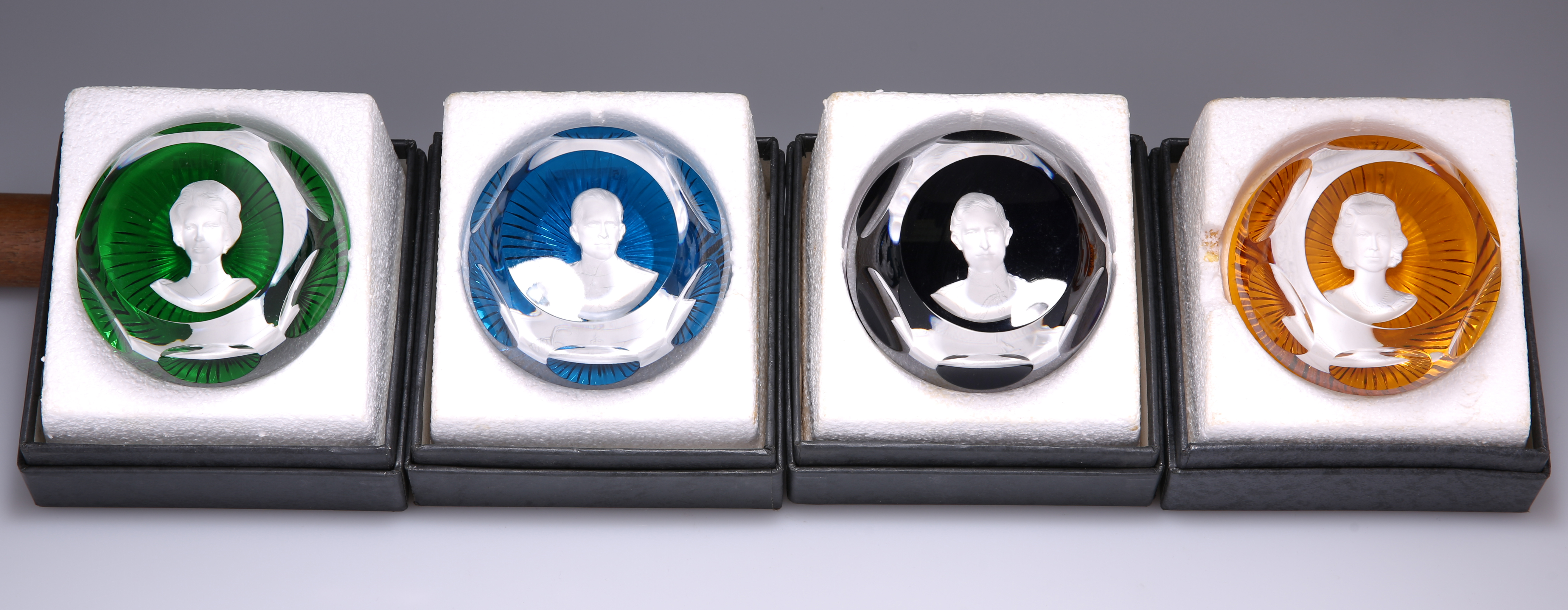 A SET OF FOUR BACCARAT ROYAL COMMEMORATIVE PAPERWEIGHTS, "THE ROYAL CAMEOS IN CRYSTAL", comprising