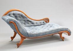 A VICTORIAN WALNUT CHAISE LONGUE, of elegant scrolling form with deep buttoned upholstery, raised on