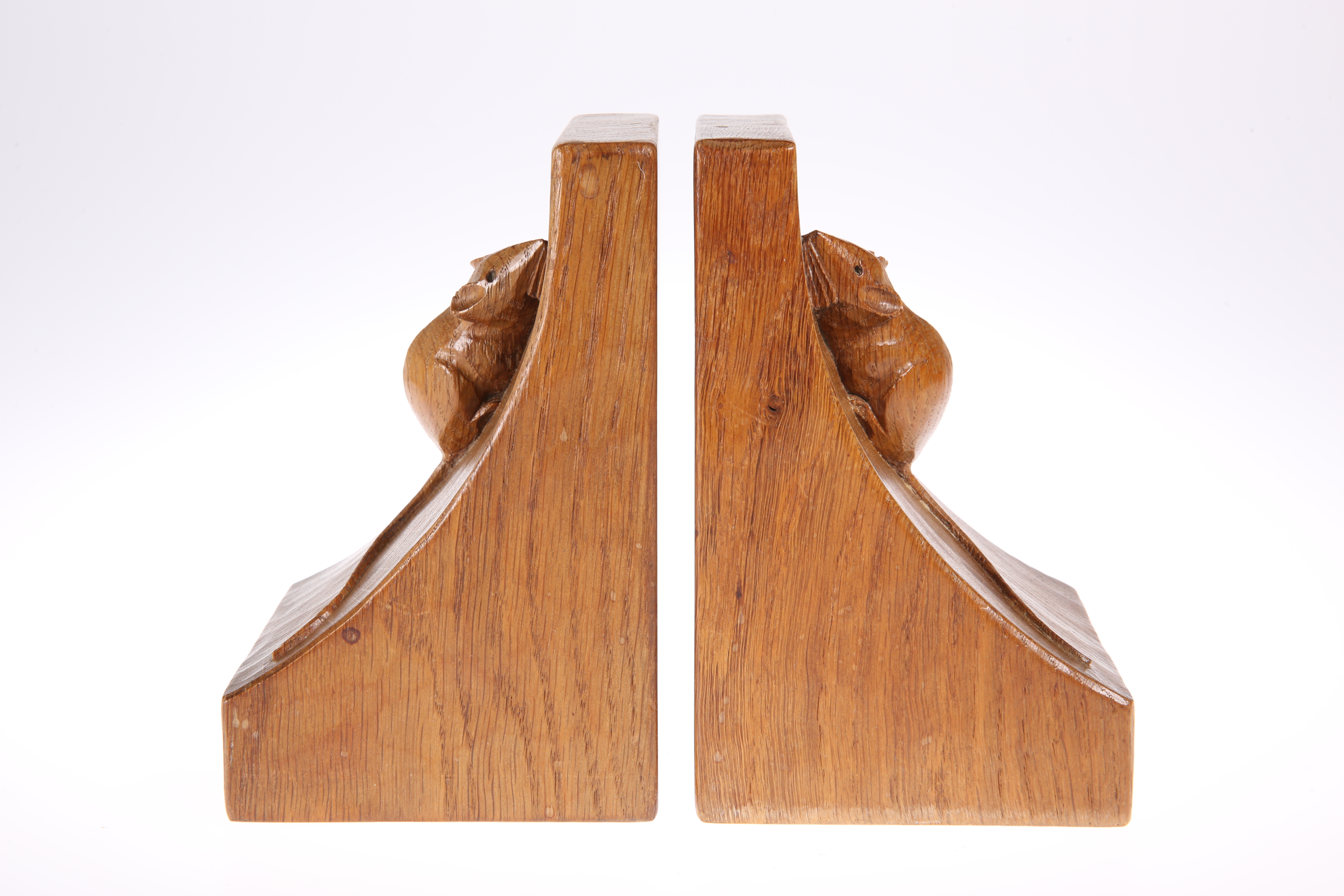 ROBERT THOMPSON OF KILBURN A PAIR OF MOUSEMAN OAK BOOKENDS, of characteristic form, adzed, carved