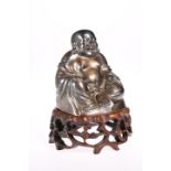 A FINE CHINESE SILVER BUDDHA, signed, the hollow figure modelled sitting with smiling expression,