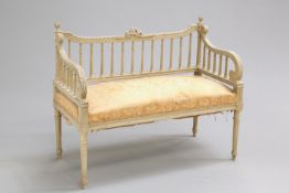 A 19TH CENTURY FRENCH PAINTED SETTEE, of small proportions, with ribbon-tied crest between sphere