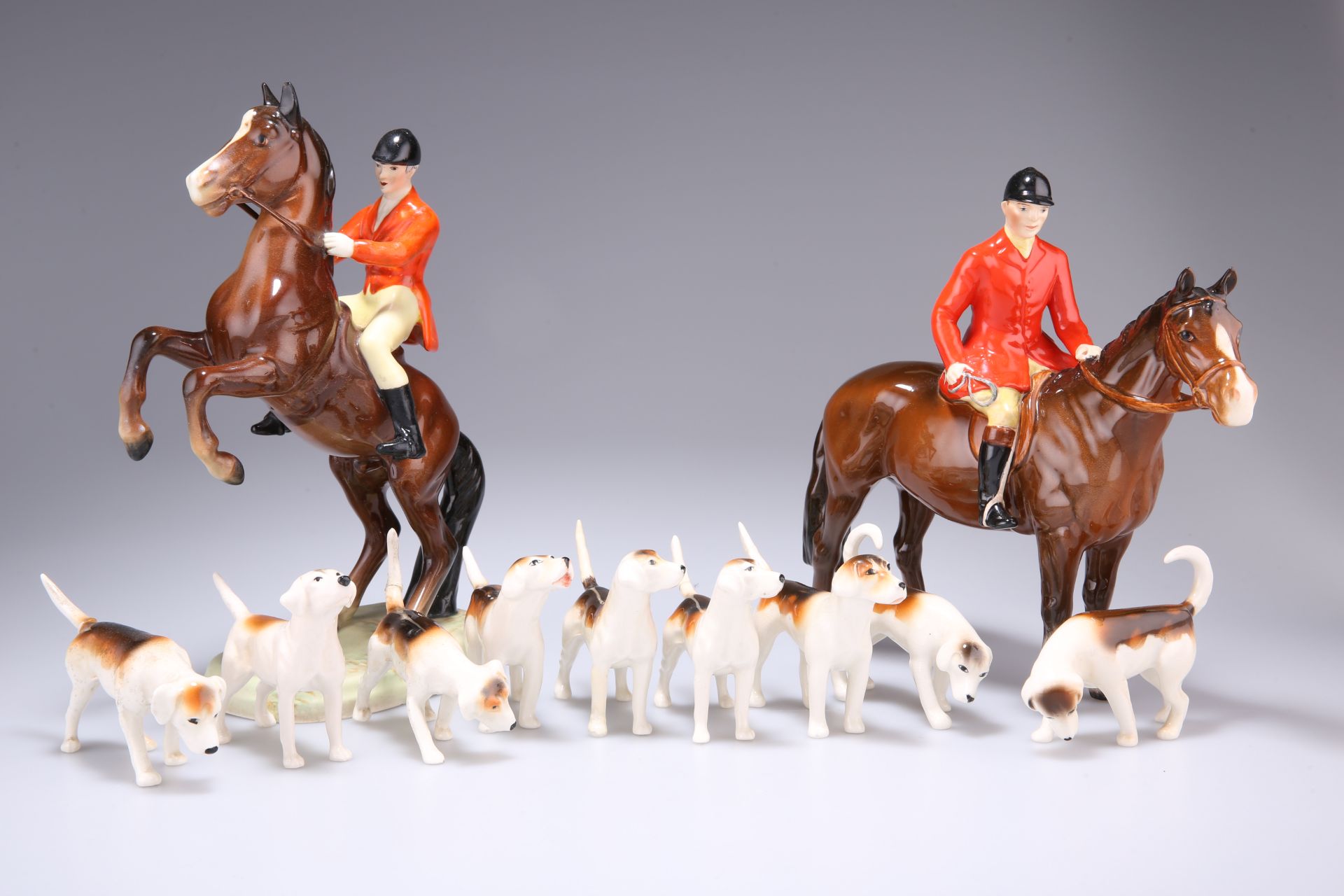 A BESWICK HUNTING GROUP, comprising Rearing Huntsman, Beswick Ware backstamp; Huntsman Standing, no.