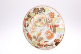 A CHINESE 'TOBACCO LEAF' PLATE, circular, painted in a palette of famille rose, burnt orange and