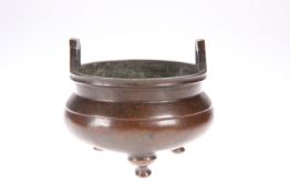 ~ A CHINESE BRONZE TRIPOD CENSER, in the Archaic manner. 11.5cm diameter, 593 gramsThe absence of