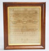 A GEORGE III NEEDLEWORK SAMPLER, dated 1780, worked by Elizabeth Hoth, in a rosewood frame under