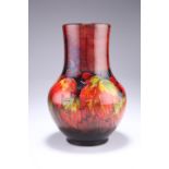 WILLIAM MOORCROFT A LARGE FLAMBE 'LEAF AND BERRY' VASE, of baluster form, Royal Warrant paper label,