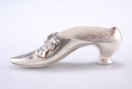 AN EDWARDIAN SILVER SHOE PIN CUSHION, by Adie & Lovekin Ltd, Birmingham 1906, in the form of a dress