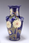 A BLUE-GLAZED POTTERY VASE, of baluster form with moulded lion mask 'handles', incised and