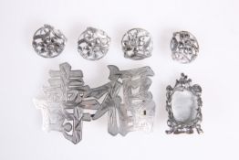 A CHINESE EXPORT SILVER BELT BUCKLE, by Kwan Wo, c.1880-1920, in the form of pierced characters