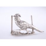 AN EDWARDIAN SILVER MENU HOLDER IN THE FORM OF A PHEASANT, by Charlie Jacques & Frederick