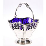 A GEORGE V SILVER SWING-HANDLE SUGAR BASKET, by Mappin & Webb Ltd, Birmingham 1912, with pierced