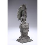 A CAMBODIAN BRONZE BUDDHA, seated with Naga, 18th Century. 33.5cm