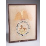 A NORTHUMBERLAND FUSILIERS NEEDLEWORK PANEL, framed. Overall 37.5cm by 29.5cm