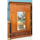 A LATE VICTORIAN MAHOGANY MIRROR-DOOR WARDROBE