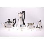 AN ART NOUVEAU SILVER MATCHED FOUR-PIECE TEA SET, by Sibray Hall & Co Ltd (Charles Clement