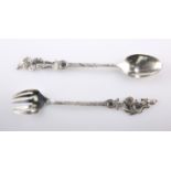 A PAIR OF BERTHOLD MULLER SILVER SALAD SERVERS, London import mark 1911, the five tine fork and