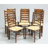 A MATCHED SET OF EIGHT LANCASHIRE ELM AND OAK RUSH-SEATED LADDER BACK DINING CHAIRS, each with