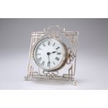 AN EDWARDIAN SILVER MOUNTED DESK CLOCK, by John Tiley, London 1905, the fret work strut surround