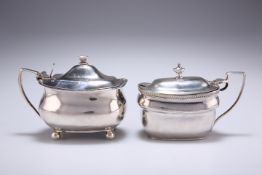 A GEORGE III SILVER MUSTARD, by Charles Chesterman II, London 1807, with gadrooned rim, blue glass