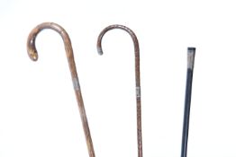 TWO EARLY 20TH CENTURY SILVER MOUNTED CROOK HANDLED BAMBOO WALKING STICKS, Christopher Walker,