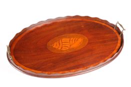 AN EDWARDIAN INLAID MAHOGANY OVAL TRAY, with twin brass handles, centred by an inlaid conch shell