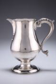 A GEORGE III SILVER JUG, by John King, London 1769, of tapered bulbous form with spout and S-