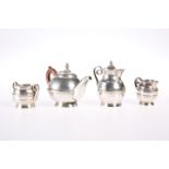 A FOUR-PIECE MINIATURE TEA SERVICE, comprising teapot, hot water jug, sugar bowl and cream jug,