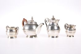 A FOUR-PIECE MINIATURE TEA SERVICE, comprising teapot, hot water jug, sugar bowl and cream jug,