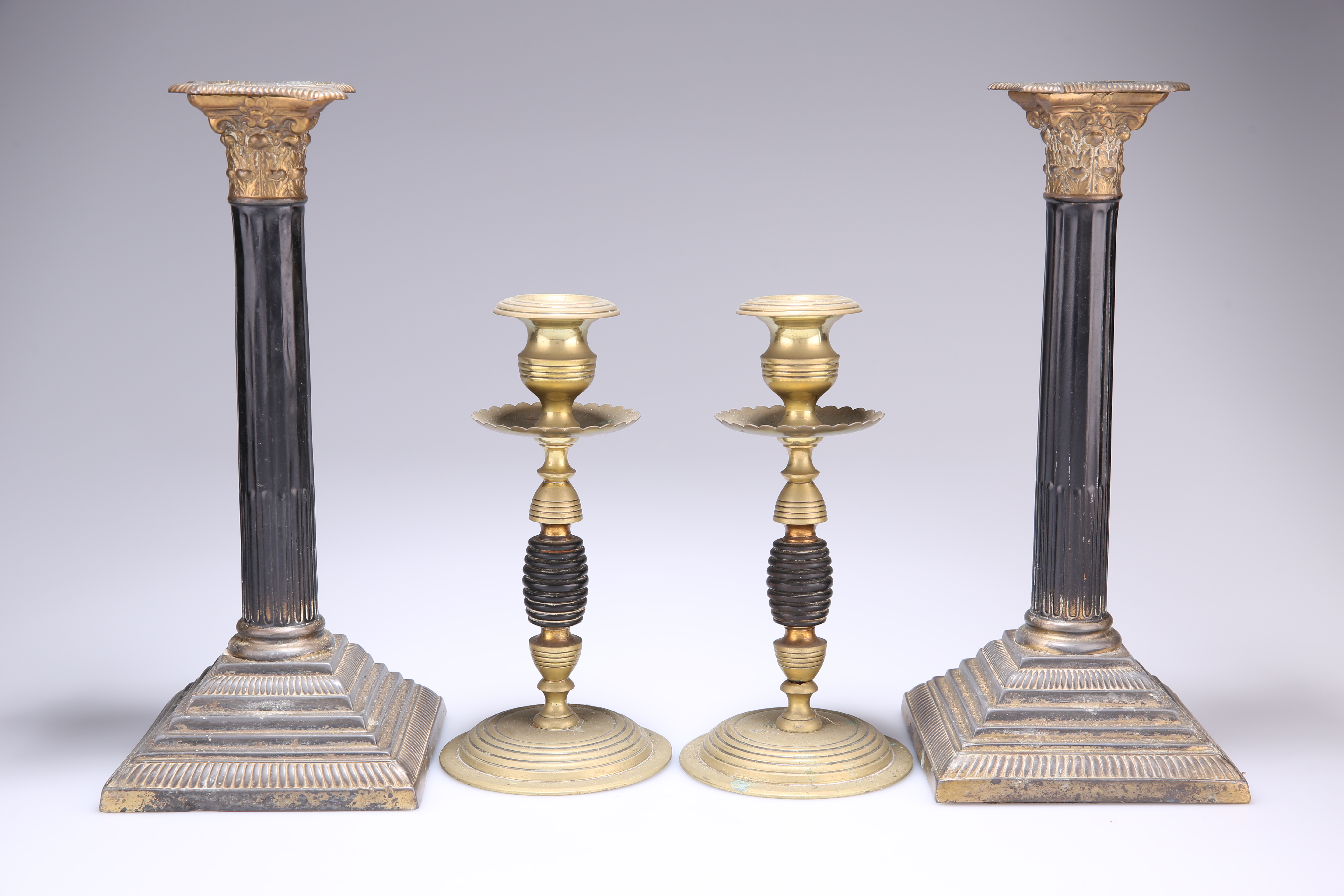 ~ A PAIR OF 19TH CENTURY GILT-BRASS AND LACQUERED CORINTHIAN COLUMN CANDLESTICKS, each with