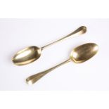 A PAIR OF GEORGIAN SILVER-GILT HANOVERIAN PATTERN DESSERT SPOONS, marks rubbed, hallmarked London,