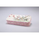 A CHINESE FAMILLE ROSE INK BOX, rectangular with inverted corners, the cover painted with rockwork