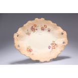 A ROYAL WORCESTER BLUSH IVORY BOWL, of shaped oval form with twin pierced handles, painted with four