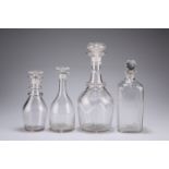 A GROUP OF FOUR GEORGIAN AND VICTORIAN GLASS DECANTERS, the first with panel-cut shoulder and