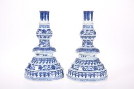 A PAIR OF CHINESE MING STYLE BLUE AND WHITE CANDLESTICKS