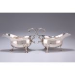 A PAIR OF GEORGE III SILVER SAUCE BOATS, possibly by Thomas Streetin, London 1818, of typical