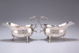 A PAIR OF GEORGE III SILVER SAUCE BOATS, possibly by Thomas Streetin, London 1818, of typical